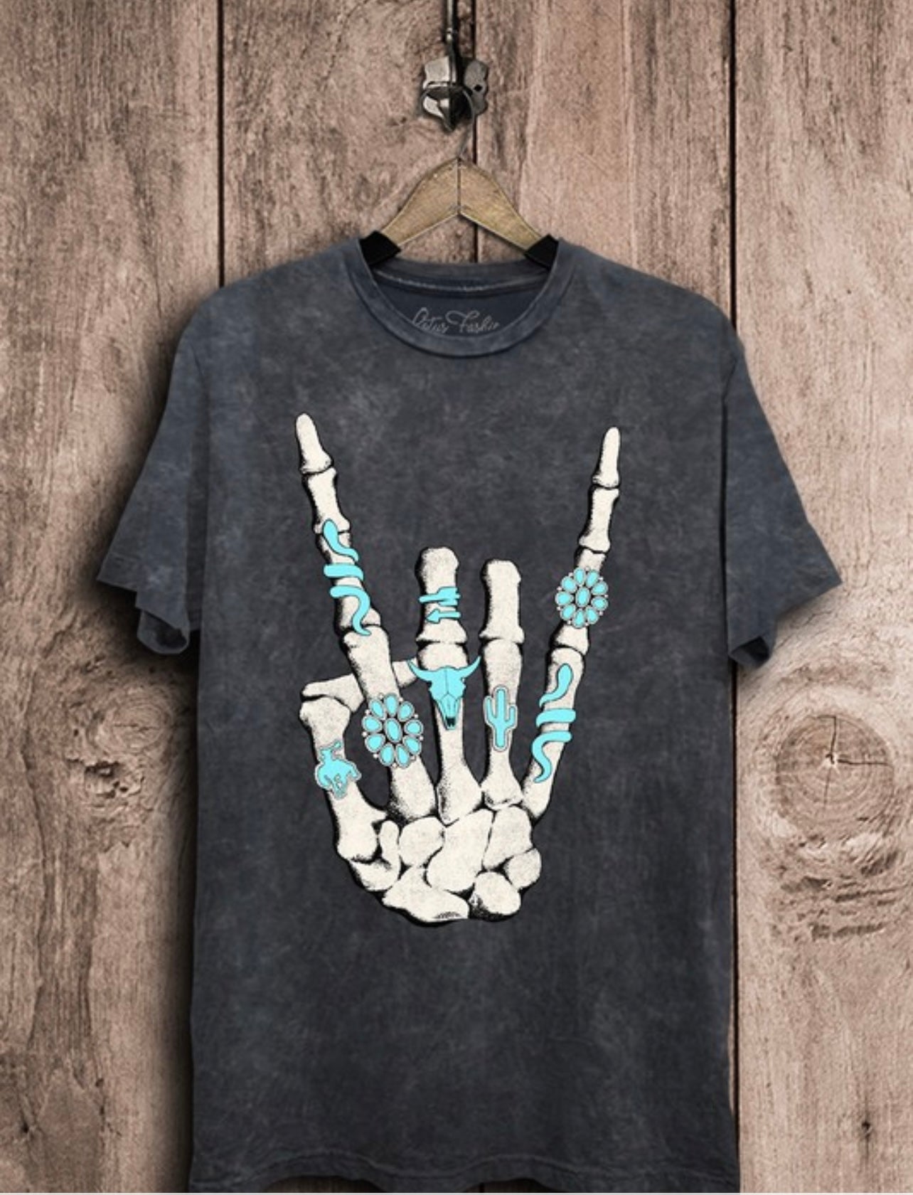 Vintage Black Tee with a white hand with the rock on hand sign, featuring turquoise stones that look like rings